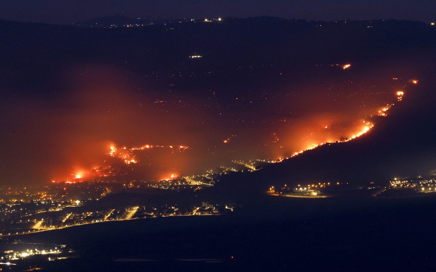 Fires rage in northern Israel after rocket attacks; key roads closed off