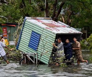 Vietnam floods leave at least 14 dead or missing