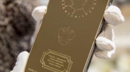 Gold iPhone with engraving of Vladimir Putin's head goes on sale for £2,500 - PHOTO