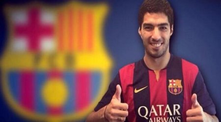 Suarez touches down in Spain to sign Barcelona deal