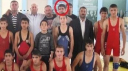 Why did an Azerbaijani wrestling champion join IS?