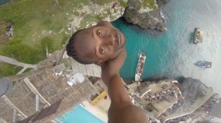 Video shows brave Jamaican make extreme dive off 100ft cliff - VIDEO