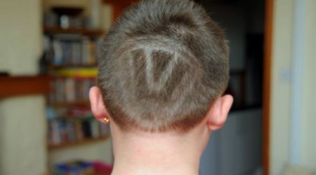 Boy taken out of school because of having a VW logo shaved into his hair