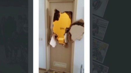 Trapped in Sochi bathroom, bobsledder punches hole in door