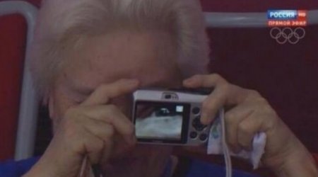 Elderly spectator snaps all the action at Sochi