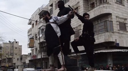 ISIS release horrific photos of a man having his hand amputated for theft