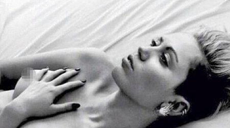 Miley Cyrus goes topless in sultry bedroom