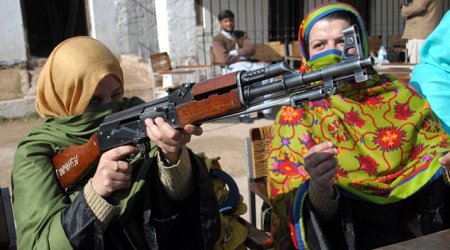 Women trained to use Kalashnikovs and handguns… to defend their CLASSROOMS