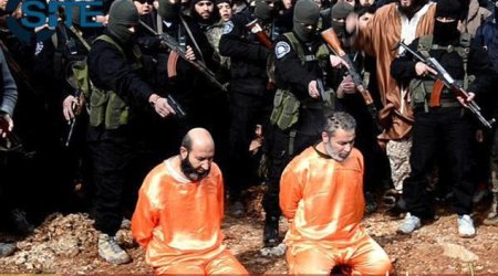 ISIS publicly executes two 'spies' and CRUCIFIES another