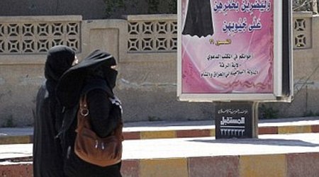 ISIS morality police arrest a woman wearing full burkha and face veil