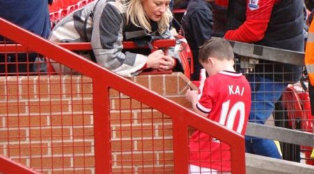 Kai Rooney, five, is asked for his AUTOGRAPH