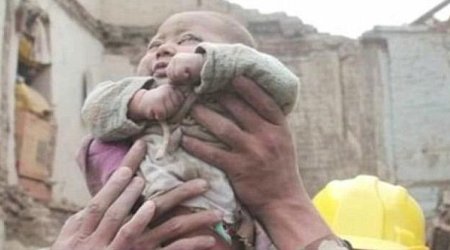 Incredible moment four-month-old baby is pulled ALIVE from the rubble