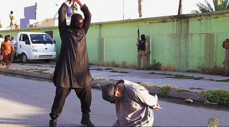 ISIS executioners behead three men accused spying for the government