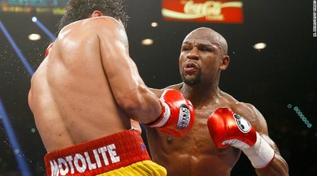 Floyd Mayweather and Manny Pacquiao punch above weight