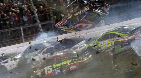 NASCAR driver flips over racetrack before smashing into fence at 200mph