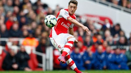 Arsenal midfielder Mesut Ozil shows his caring side