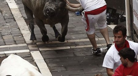 Runner is gored by a bull during the annual festival in Pamplona