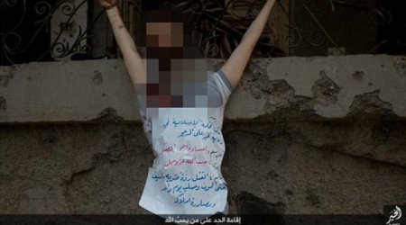 ISIS thugs behead blindfolded man and crucify his corpse ...