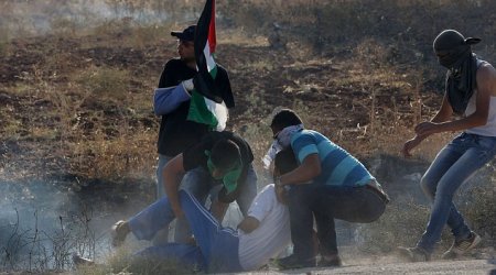 Palestinian youth shot dead by Israeli troops during protest