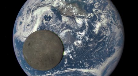 Space telescope catches the moon crossing the Earth from the 'dark side'