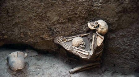 4,000-year-old skeletons of mother and child are found locked