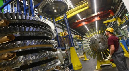 German economy expands less than forecast as global risks loom
