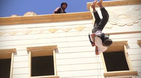 Two gay men are thrown off tall building by ISIS