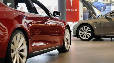 Thanks for buying a $100,000 Tesla. Want a tote bag with that?