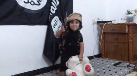 Shocking new ISIS video shows baby-faced three-year-old boy behead his TEDDY BEAR