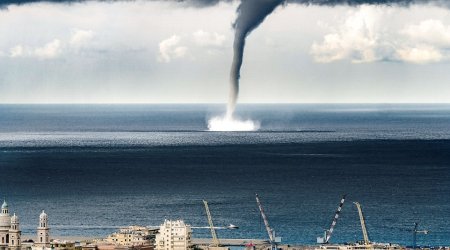 Incredible moment a massive waterspout descended on Italian coastal town