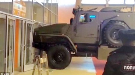 Woman attempts to drive off in an armoured personnel carrier