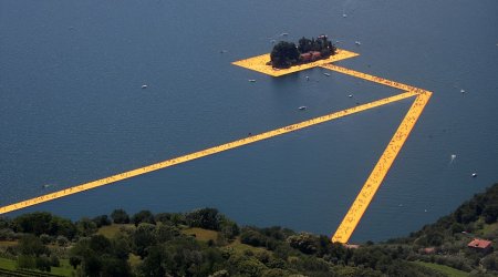 Thousands of tourists flock to Italian lake to stroll on a 1.9-mile floating art installation