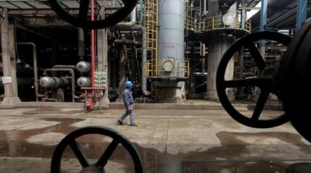 Oil stable as market seen in balance, but slow Asian demand hurts