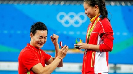 A marriage proposal at the Olympics medal ceremony