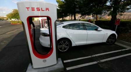 Tesla touts speed and driving range with new upgraded battery