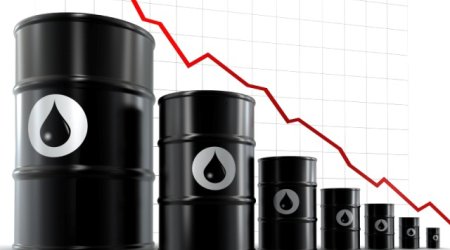 Oil falls on strong dollar, crude glut