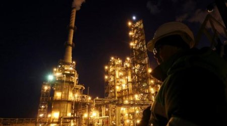 Brent crude futures ease as hope for output freeze fades