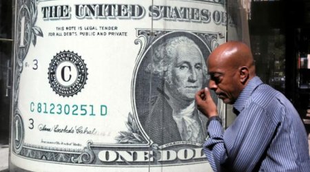 Dollar recedes from seven-month peak, lifts oil