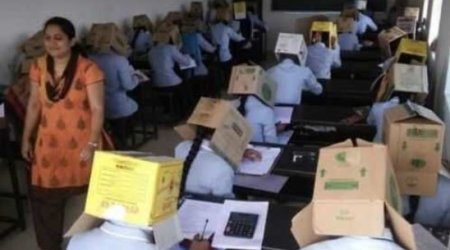 Tələbələrin başlarına qutu keçirib imtahana saldılar — FOTO