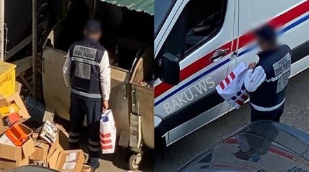 Bakıda təcili yardım maşınının sürücüsü zibil qutularını eşələyir -VİDEO