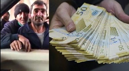 Bakıda naməlum şəxs insanlara pul paylayır - VİDEO 