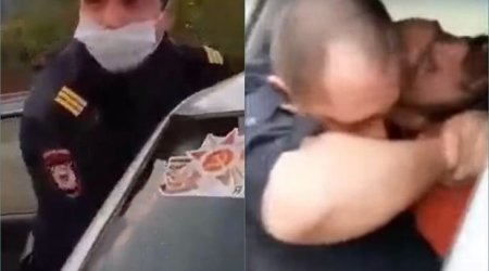 Rusiyada polis xidməti maşında şübhəlini boğmağa cəhd etdi - VİDEO