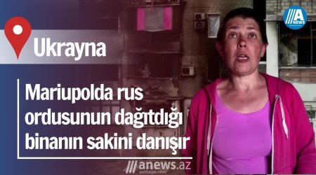 Mariupolda rus ordusunun dağıtdığı binanın sakini danışır
