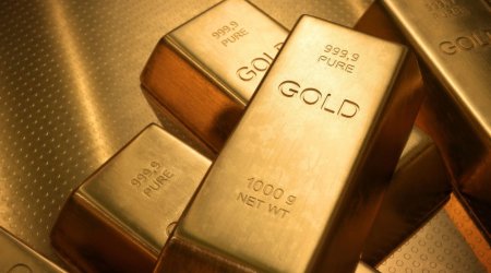 Золото подешевело на росте доходности американских гособлигаций