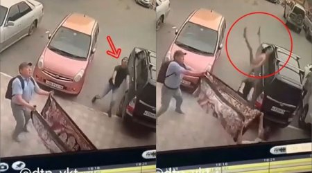 Yıxılan uşağı havada tutan kişinin qolları sındı - VİDEO