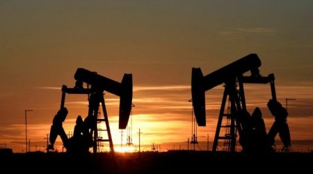 Oil prices fall by almost 1%