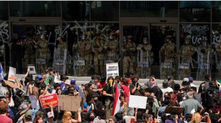 California sues Trump over National Guard deployment as migrant protests escalate