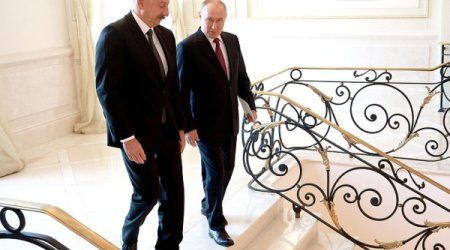 Aliyev and Putin shake hands in Beijing