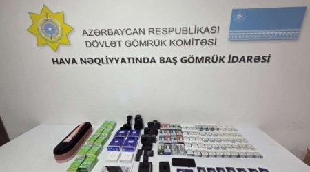 Mobil telefonda gizlədilmiş qızıl külçələr aşkarlanıb