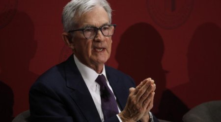 Fed holds rates steady despite pressure from Trump